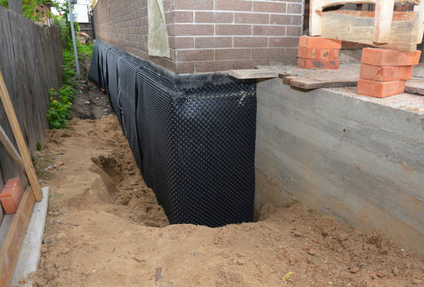 Happy homeowners after waterproofing job in Springville